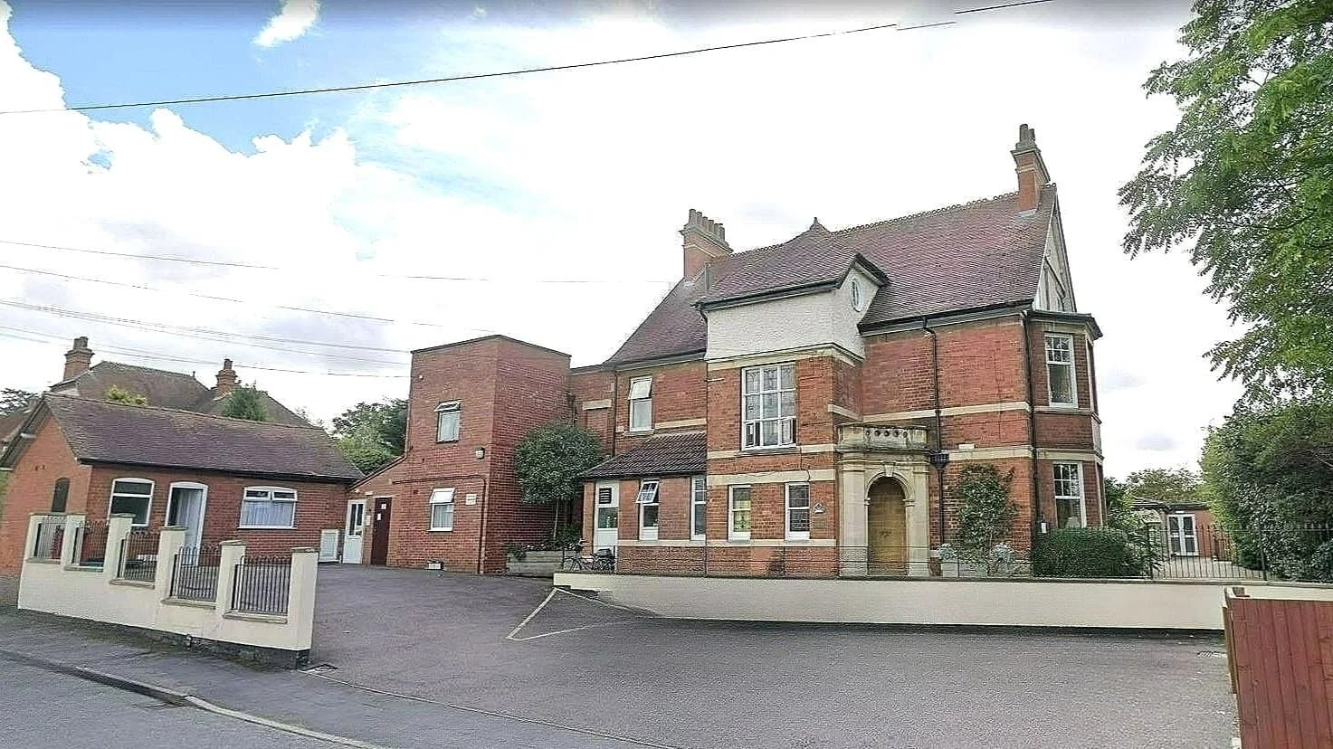 Harrowby Lodge entrance and visitor parking in Grantham